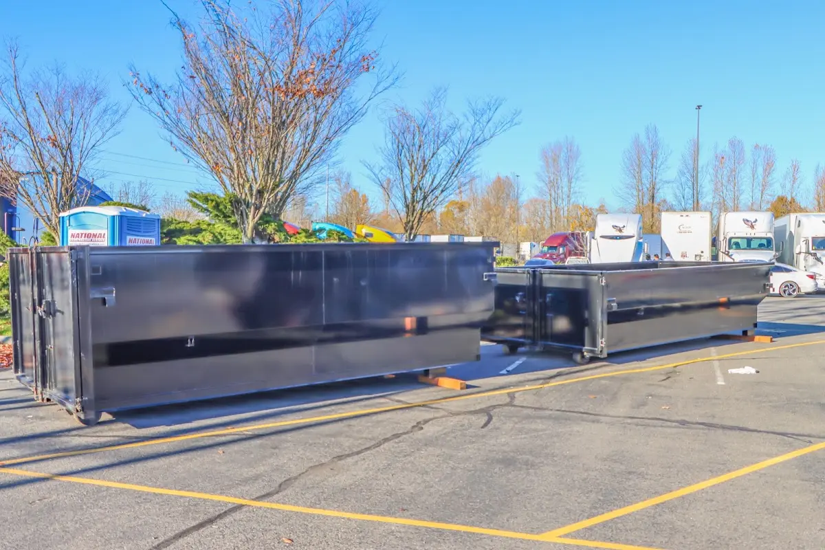 Professional dumpster rental service with roll-off container on residential driveway in Wyomissing